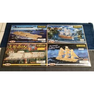 Lot of 4 Large Wood Puzzle 3D Kits Train Aircraft Carrier Pirate Ship Sail Boat
